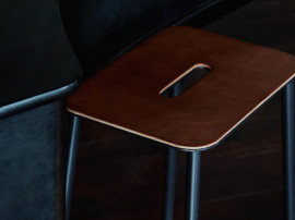 Adam stool.  Nature rectangular leather seat. Black, grey or white base. H50. 