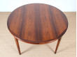 Extendable circular dining table in Rio rosewood