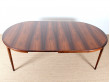 Extendable circular dining table in Rio rosewood
