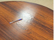 Extendable circular dining table in Rio rosewood