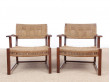 Mid-Century Modern pair of arm chairs  with woven sea grass.