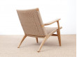 Mid-Century modern scandinavian arm chair in oak model CH 25 by Hans Wegner. New edition