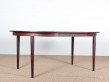 Mid-Century Modern danish extendable round dining table in Rio rosewood. 
